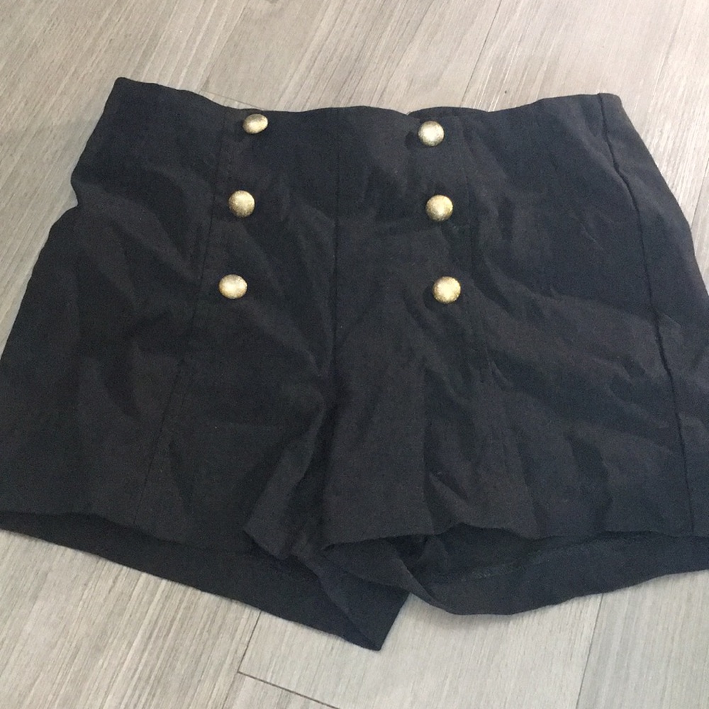 Spandex shorts with gold buttons